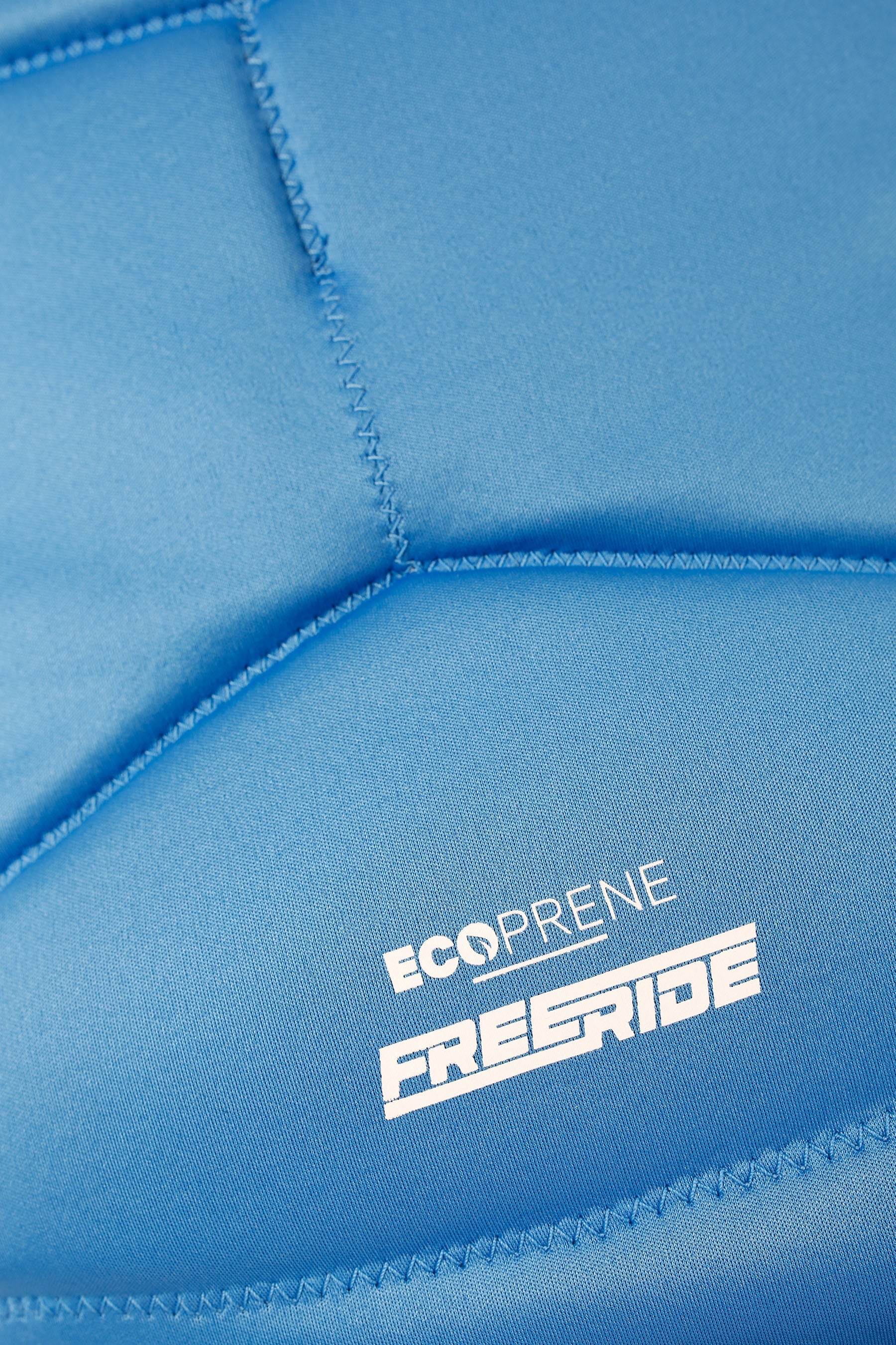 Close-up of blue eco-friendly neoprene with 'Ecoprene ƒ?? Freeride' logo.