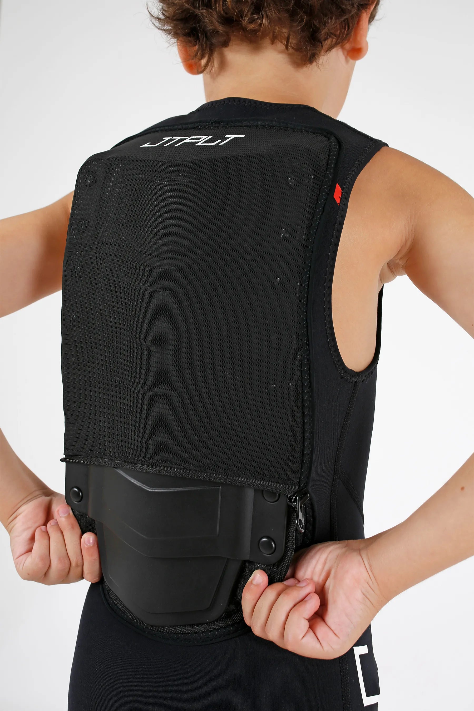 Person wearing a Jetpilot Vault Youth Race John - Black/Red with 'JETPILOT' branding on a white background