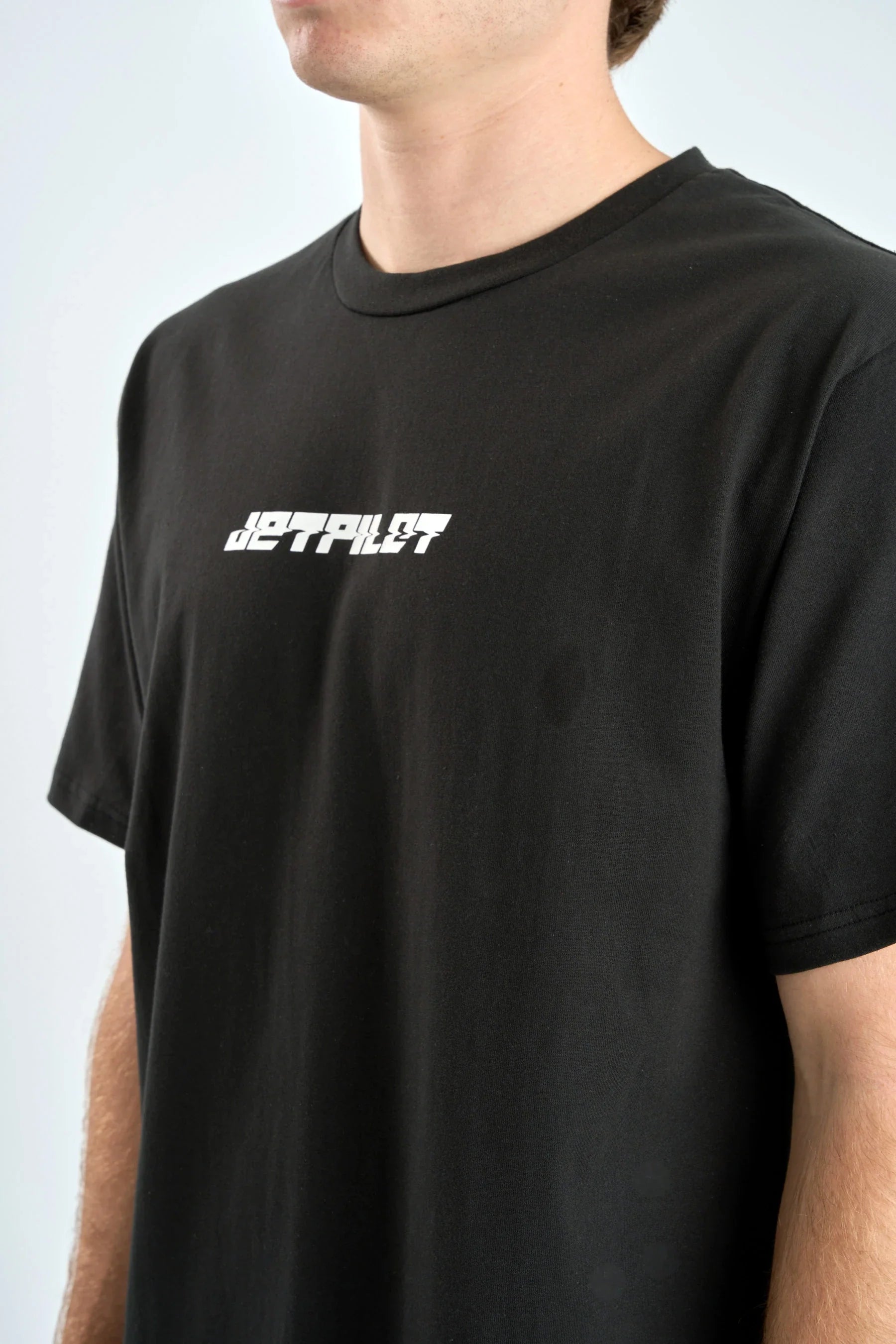 Black t-shirt with white text on a plain background