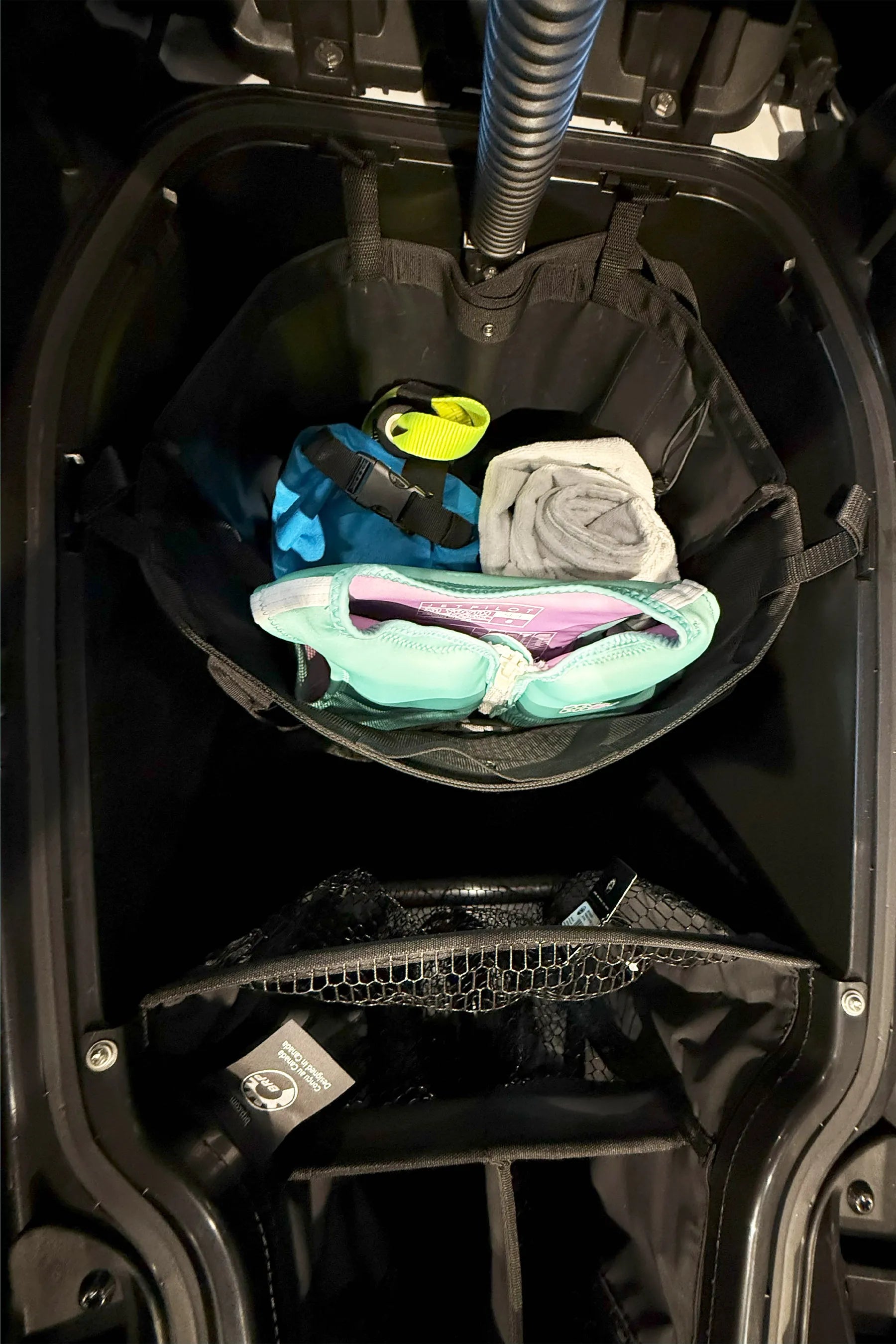 Jetpilot Essentials Tote Bag sitting clipped into a seadoo jetski cargo area
