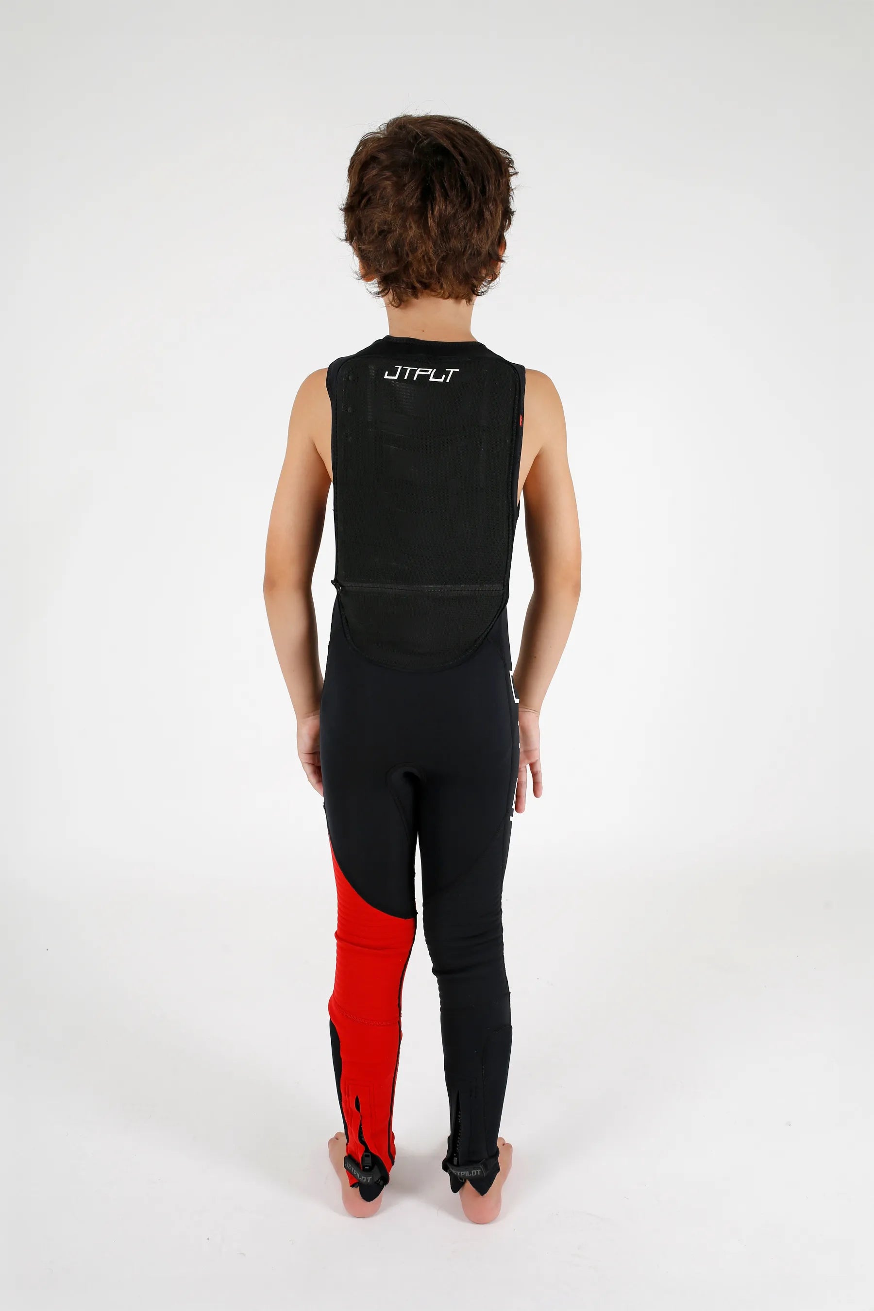 child wearing a black and red wetsuit on a white background