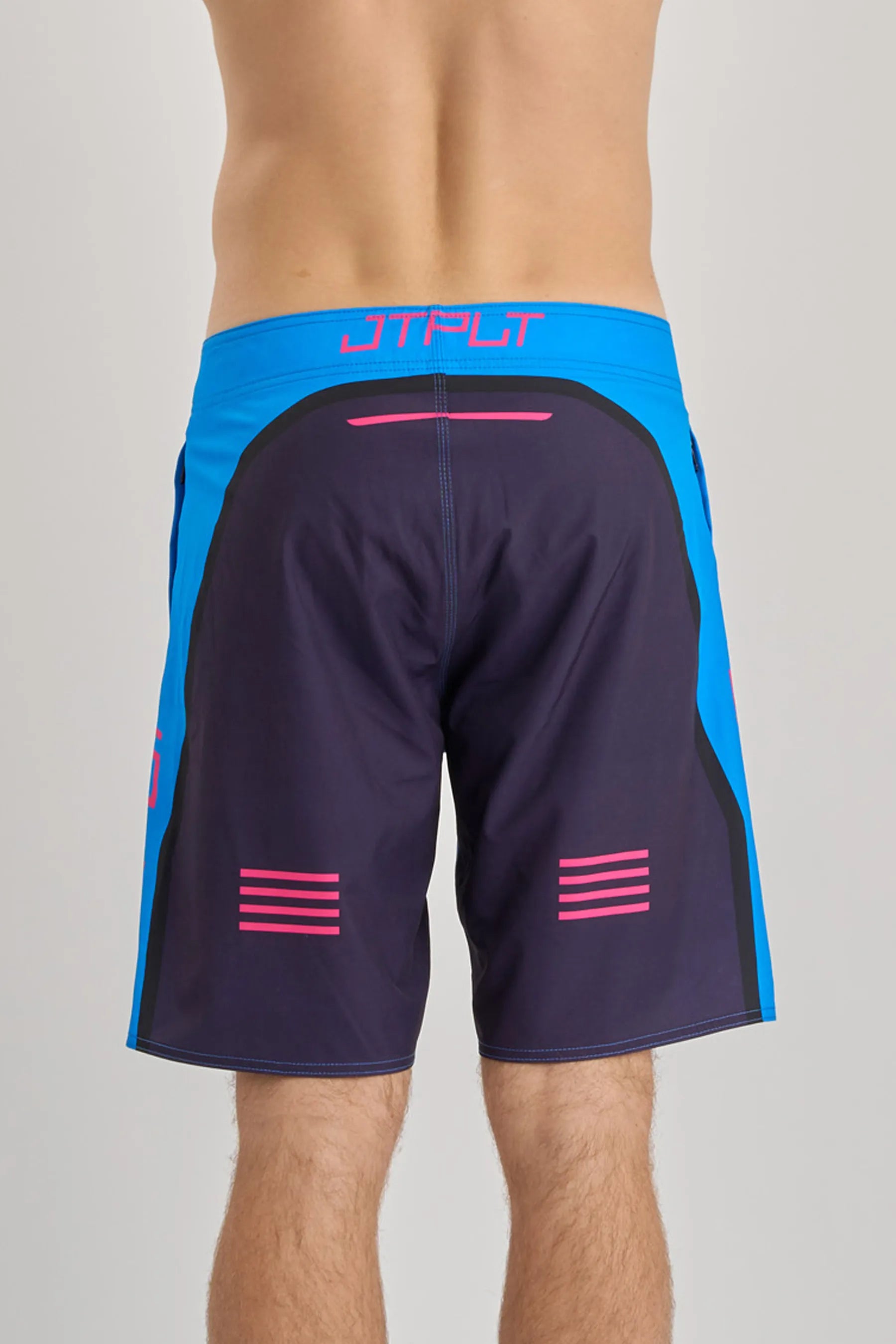 Black board shorts with blue sides and pink accents on a gray background