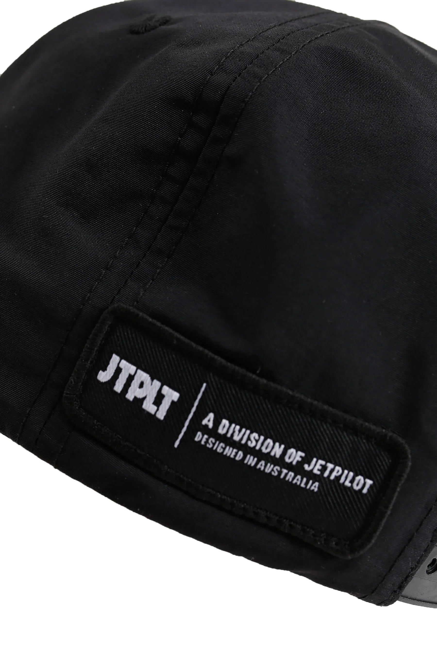 Black cap with a JTPLT patch on a white background