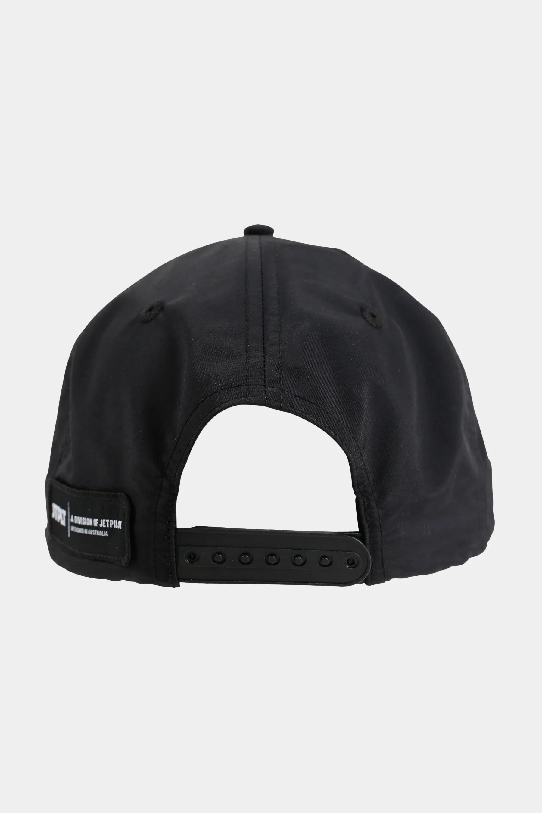 Black cap with a brand label on a light grey background